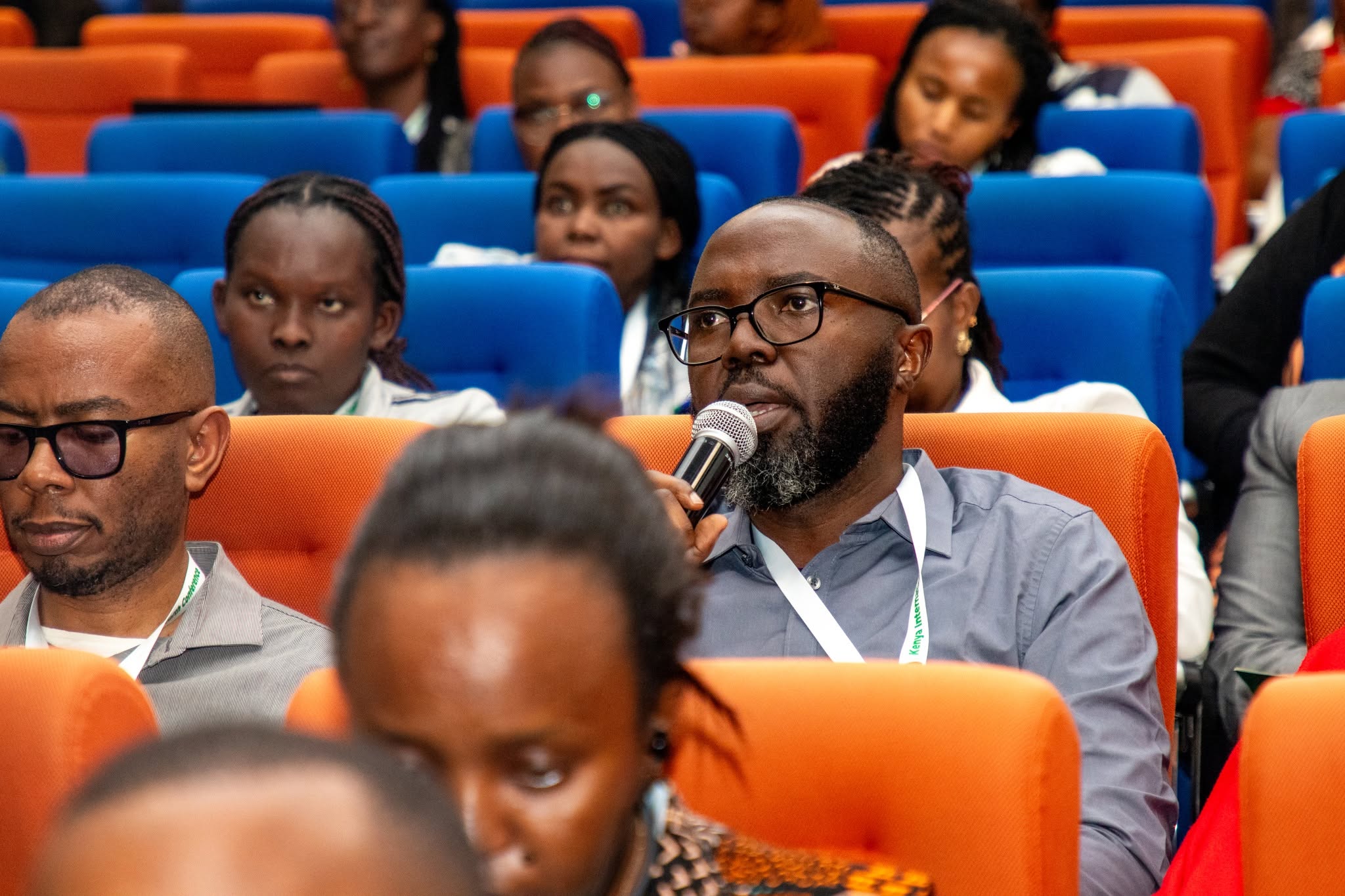 A delegate speaks from the audience