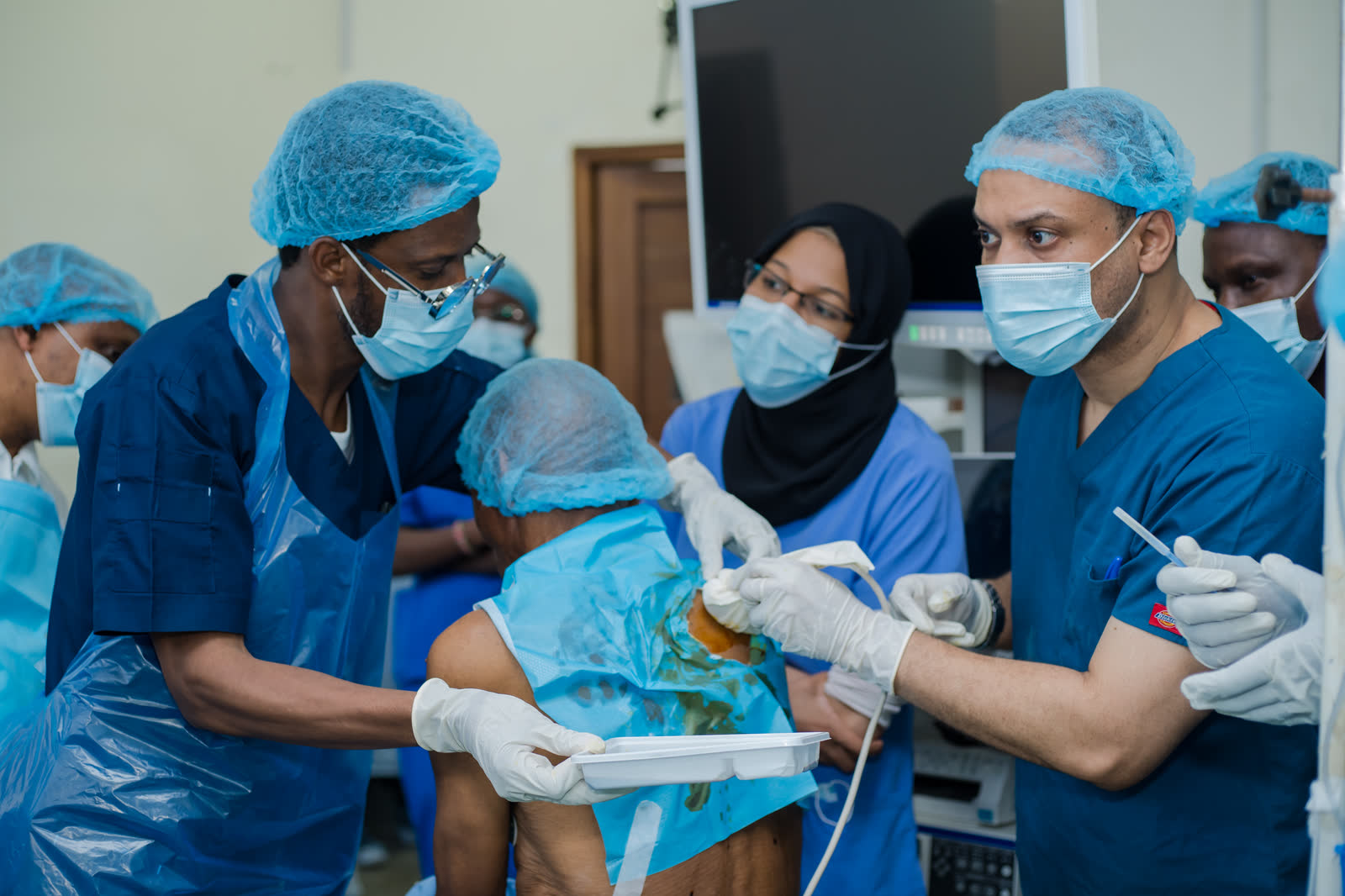 Faculty perform an ultrasound-guided pleural procedure during a live session